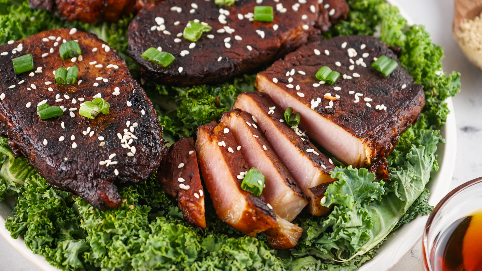 Asian style pork chops with sesame seeds and green onions.